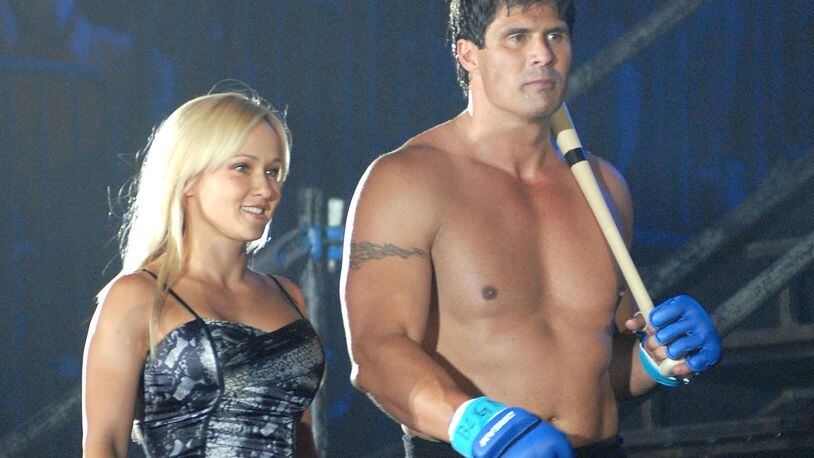 Former Oakland Athletics slugger Jose Canseco (R) and Heidi Northcott walk to the ring prior to a match with Choi Hong-man in the first Round of the Super Hulk Tournament during Dream.9 at Yokohama Arena on May 26, 2009 in Yokohama, Kanagawa, Japan. (Photo by Hiroki Watanabe/Getty Images)