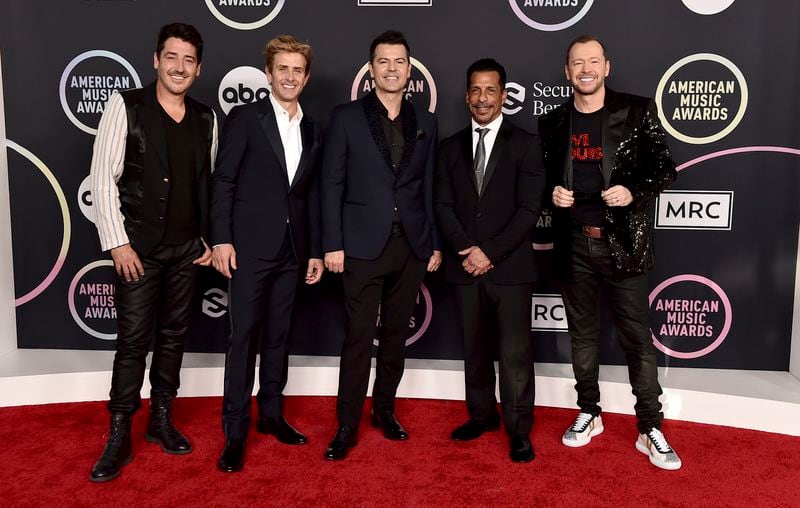 Jonathan Knight, left to right, Joey McIntyre, Jordan Knight, Danny Wood and Donnie Wahlberg of New Kids On The Block arrive at the American Music Awards on Sunday November 21, 2021 at the Microsoft Theater in Los Angeles.  (Photo by Jordan Strauss / Invision / AP).  The group will perform in Columbus on June 25