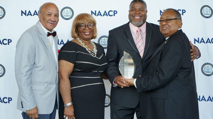 The Dayton Unit NAACP received the national organization’s top honor, the Thalheimer Award, in July. Pictured (from left) are Tom Roberts, Ohio Conference NAACP state president, Gloria Sweetlove, NAACP’s chair of memberships and units committee, Dayton Unit President Derrick Foward, and Leon W. Russell, chairman of the NAACP board of directors. CONTRIBUTED