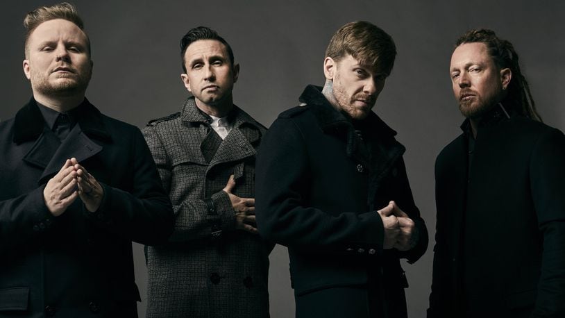 Shinedown, (left to right) Zach Myers, Eric Bass, Brent Smith and Barry Kerch, performs at the Nutter Center in Fairborn on Tuesday, Feb. 26. CONTRIBUTED/JIMMY FONTAINE
