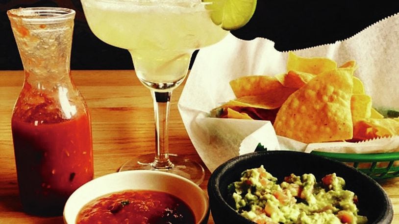 Salsa, guacamole, chips and an ice cold margarita served up at Taqueria Mixteca’s Trotwood location. Photo by Alexis Larsen