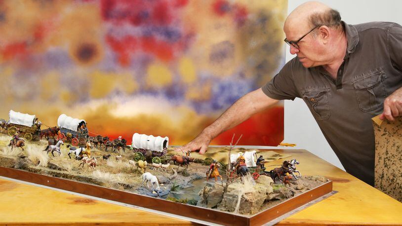 David Levinthal arranges toy figures in his studio for a photo shoot. CONTRIBUTED