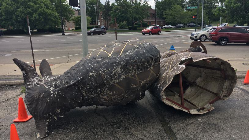 K12 Gallery and TEJAS said she is reviewing the footage from recently installed security cameras installed after vandalism issues to determine whether a large bison statue in front of their Jefferson Street gallery was blown over by the wind or knocked over. JOSH SWEIGART/STAFF