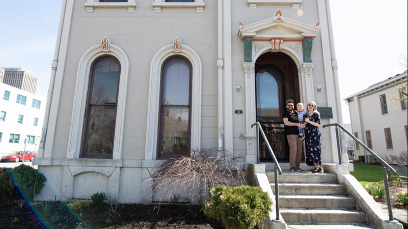 Mann  (R) with her family in front of their newly renovated home - the Isaac Pollack house in 2022. The family moved in in 2023. L-R Husband Aaron Stephenson, holding River and Mann, pregnant with Finn. CONTRIBUTED