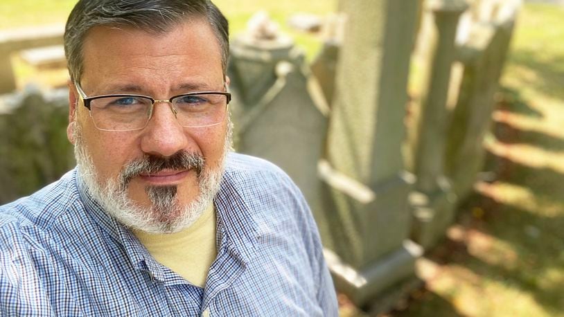 Marshall Weiss, pictured at Temple Israel’s Riverview Cemetery, spent much time exploring Dayton area’s Jewish cemeteries for research on his new book, “Stories of Jewish Dayton.” CONTRIBUTED