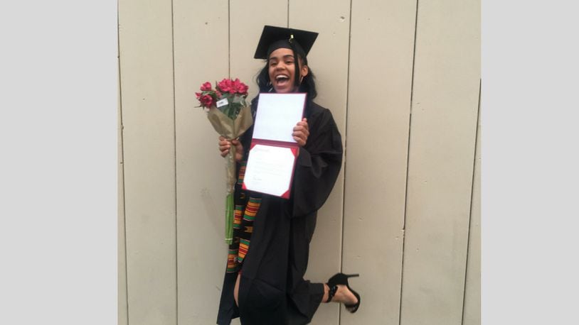 Ashli Garnett  is the first student at Paul Laurence Dunbar Early College High School to earn an Sinclair Community College associate's degree as part of a partnership between the high school and the college.