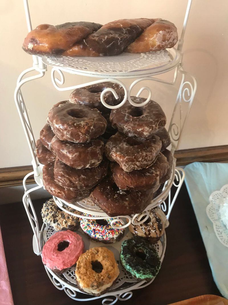 A collection of donuts made from Donut Palace's new chocolate yeast glazed donut dough.