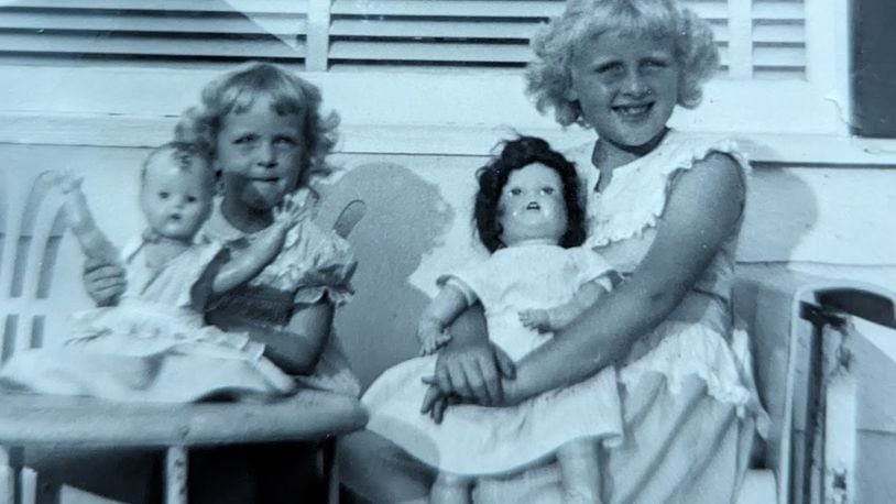 Carole Laycock of Fairfield (right) and her sister, Jane, with dolls in 1949.