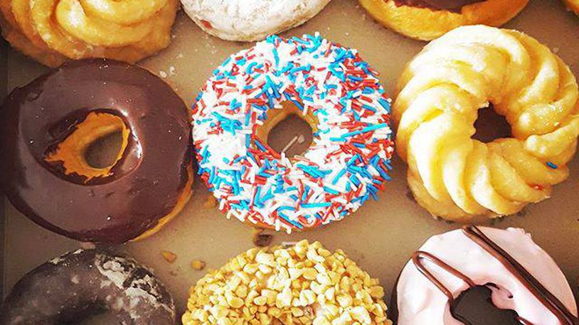 Tim Hortons and Dunkin' Donuts are competing against each other and independent doughnut shops in the Dayton area.
