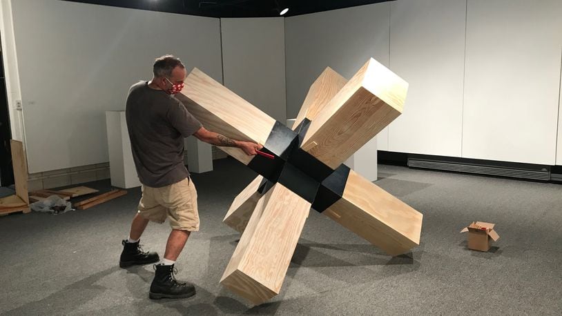 Landon Crowell installs his sculpture for Rosewood Arts Centre’s current “HWD (height, width, depth) Sculpture Exhibition 2020.” CONTRIBUTED