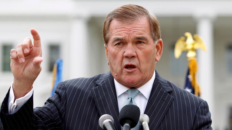In this Oct. 22, 2011, file photo, former Secretary of Homeland Security Tom Ridge speaks to a crowd of hundreds protesting in front of the White House in Washington. A spokesman says Ridge is in critical condition after undergoing an emergency heart procedure at a hospital in Austin, Texas. (AP Photo/Jose Luis Magana, File)