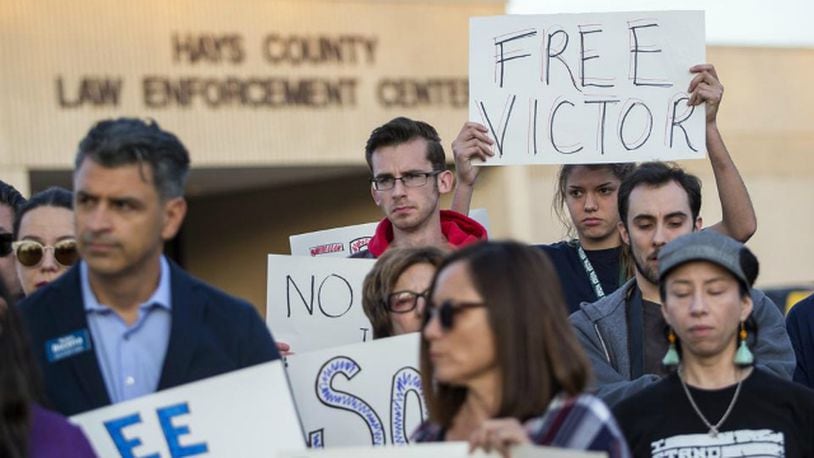 Sofia Ramirez holds up a sign reading “Free Victor” during a protest to demand the release of Victor Avendano-Ramirez outside of the Hays County Sheriff’s Office in San Marcos, Texas, on Wednesday, Jan. 31, 2018.