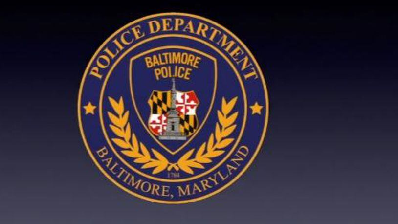 A man was arrested by Baltimore police, who said he shot at them from a minivan Monday night.