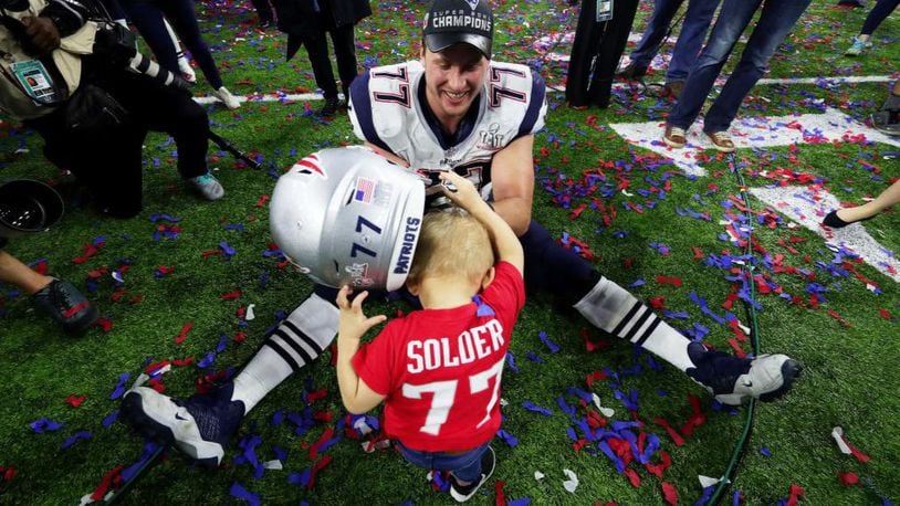 Nate Solder celebrated with his son Hudson after defeating the Atlanta Falcons 34-28 in overtime during Super Bowl LI in Houston.