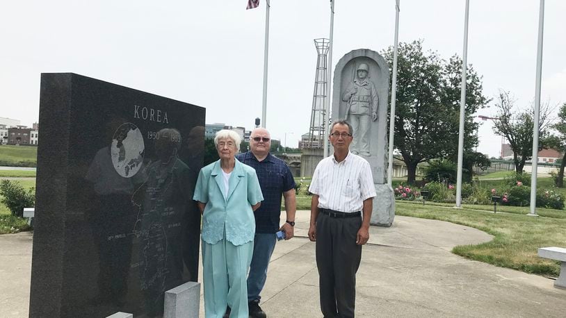 Margaret Baird was shocked at damage she saw at the Korean War Memorial in Dayton this year. She met with maintenance coordinator Segon Jang (right) and Grady Mullins (back) to think of a solution. CONTRIBUTED