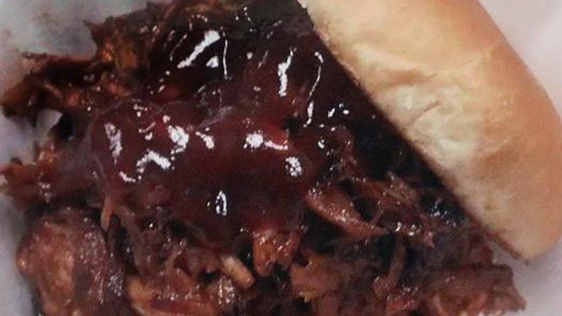 Pulled pork sandwich at Al’s Smokehouse. BILL LACKEY/STAFF