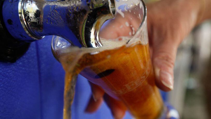 Sample craft beers from around the world at AleFest. STAFF FILE PHOTO