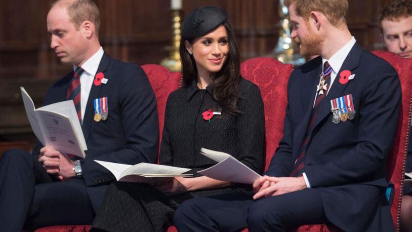 Prince William, left, sits with Meghan Markle and Prince Harry during the Anzac Day service at Westminster Abbey.
