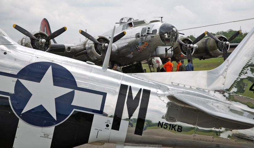 PHOTOS: Crowd welcomes the iconic Memphis Belle to its NEW exhibit at the Air Force Museum