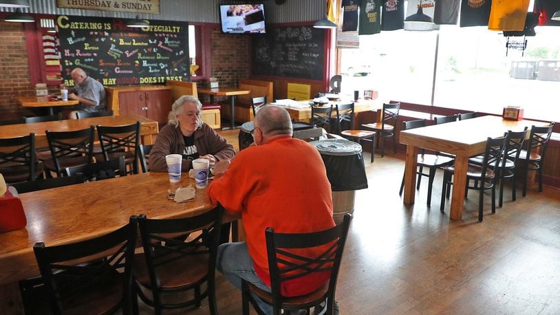 Rita Dornon and her husband, Frank, enjoyed lunch at Rudy’s Smokehouse in Springfield Thursday. Area restaurants were permitted to reopen dinning rooms Thursday as long as they followed social distancing guidelines. BILL LACKEY / STAFF