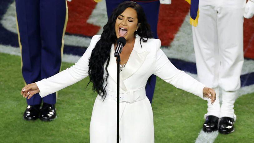Demi Lovato sang the national anthem just before kickoff, finishing it in 1:50. (Elsa/Getty Images)