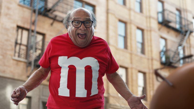 This photo provided by M&Ms shows a scene from the company's Super Bowl spot, featuring actor Danny DeVito. For the 2018 Super Bowl, marketers are paying more than $5 million per 30-second spot to capture the attention of more than 110 million viewers.