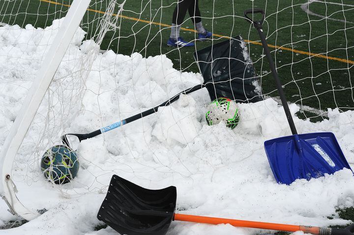 PHOTOS: Oakwood soccer players shovel snow to play
