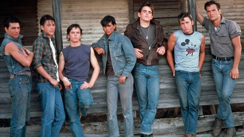 American actors Tom Cruise, Rob Lowe, C. Thomas Howell, Ralph Macchio, Matt Dillon, Emilio Estevez and Patrick Swayze on the set of The Outsiders, directed and produced by Francis Ford Coppola. (Photo by Nancy Moran/Sygma via Getty Images)