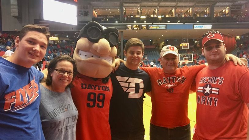 Tim Hanson poses for a photo as Rudy with brother Nick, mom Sarah, brother Andy, dad Steve and brother Matt at UD Arena. Contributed photo