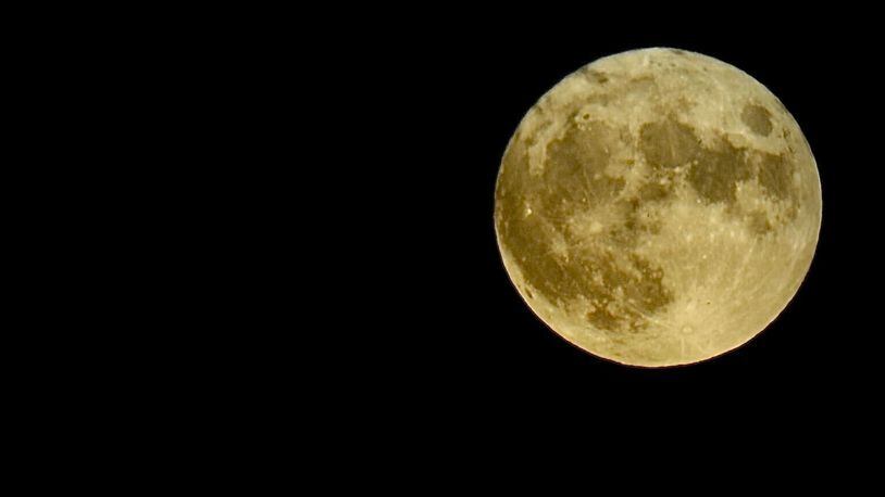 The full moon Thursday night, Aug. 11, 2022, is known as the sturgeon moon. MARSHALL GORBY/STAFF
