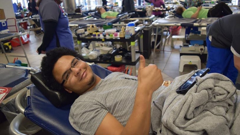 Fairmont student Gabe Davis gives a ‘thumbs up’ as he donates blood during the high school’s March Blood Drive. CONTRIBUTED