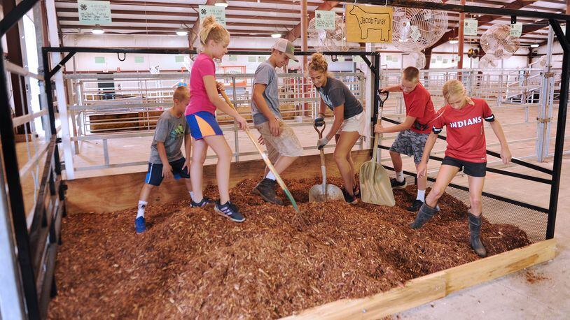 4-H kids work to prepare the barns, Thursday, July 29, 2021 for the upcoming Greene County Fair.  . MARSHALL GORBY\STAFF