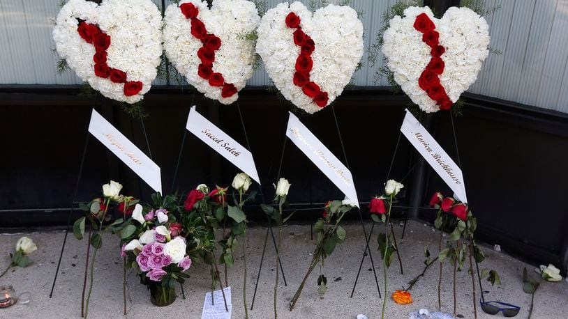 Memorials to the Dayton shooting victims and dozens of media workers filled the sidewalks of the Oregon District on Monday morning in the wake of ten people being killed, including the shooter, and more than two dozen injured at 1:00 A.M. on Sunday morning.  TY GREENLEES / STAFF