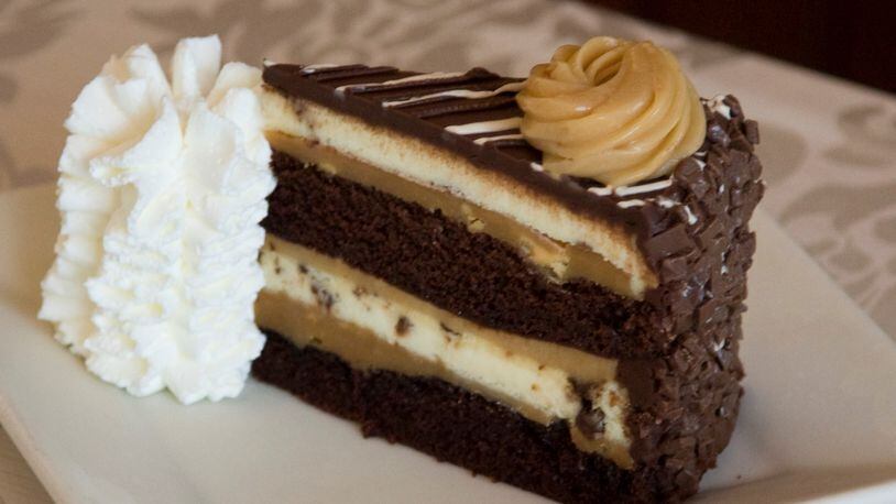 VIRGINIA BEACH, USA - JULY 29: The Cheesecake Factory's newest addition, Reese's Peanut Butter Chocolate Cake Cheesecake, is revealed on National Cheesecake Day at The Cheesecake Factory on July 29, 2010 in Virginia Beach, Virginia.  (Photo by Roberto Westbrook/Getty Images for The Cheesecake Factory)