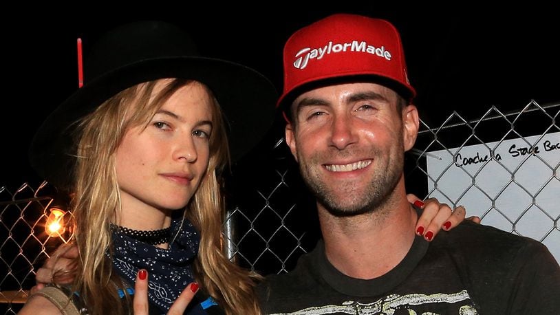 INDIO, CA - APRIL 10: Model Behati Prinsloo (L) and musician Adam Levine attend day 1 of the 2015 Coachella Valley Music & Arts Festival (Weekend 1) at the Empire Polo Club on April 10, 2015 in Indio, California.  (Photo by Christopher Polk/Getty Images for Coachella)