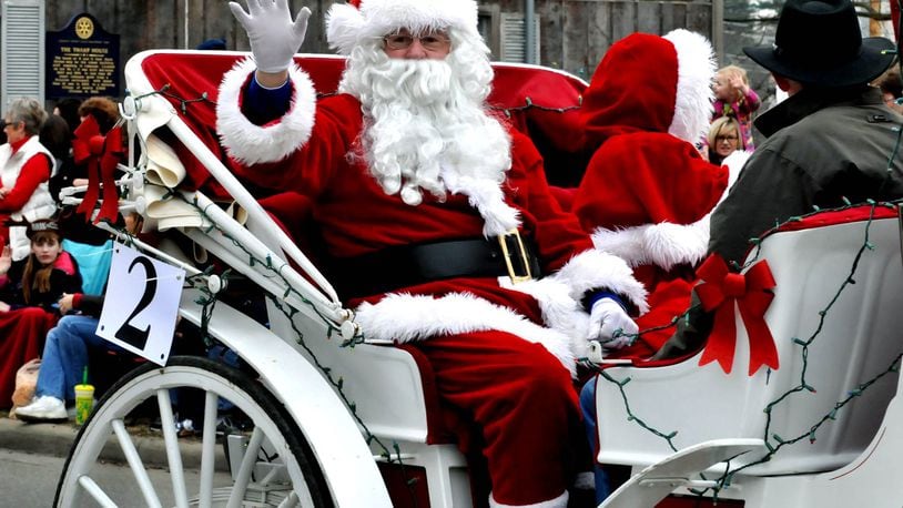 Santa and Mrs. Claus wave from their carriage as they ride in the Lebanon Carriage Parade. FILE PHOTO