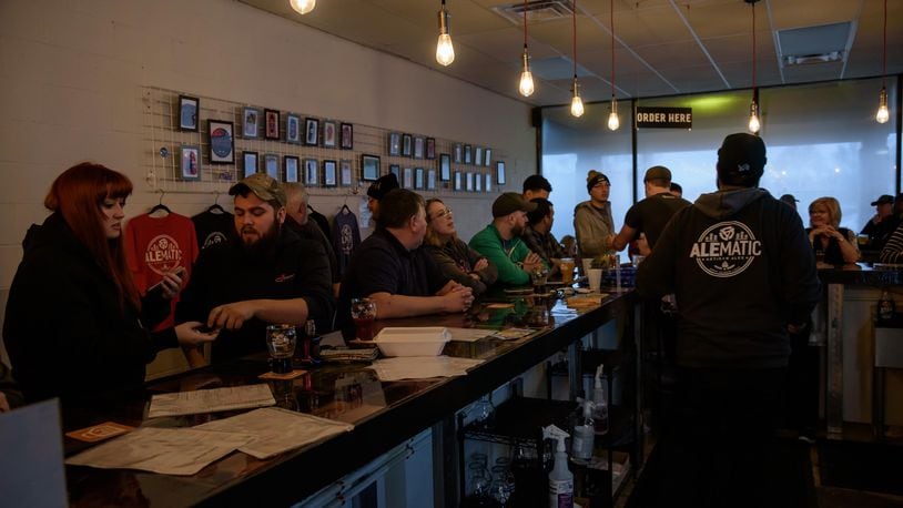 Alematic Artisan Ales, one of the Dayton-area's newest breweries, celebrated its one-year anniversary with a party on Saturday, Feb. 1. The Huber Heights brewery, located at 6182 Chambersburg Road, specializes in craft beers — including small-batch ales, lagers and sours — and also makes their own wines and ciders. TOM GILLIAM / CONTRIBUTING PHOTOGRAPHER