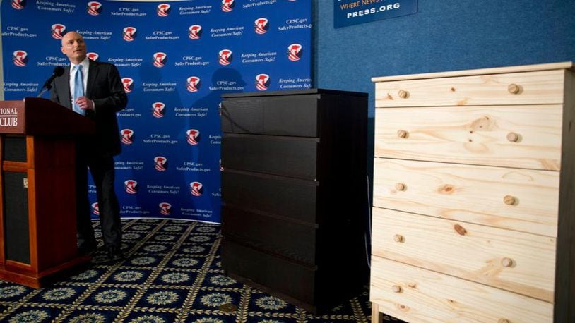 FILE - In this Tuesday, June 28, 2016, file photo, with two Ikea dressers displayed at right, Consumer Product Safety Commission (CPSC) Chairman Elliot Kaye speaks during a news conference at the National Press Club in Washington. Ikea is relaunching a recall of 29 million chests and dressers after the death of a seventh child attributed to one of the dressers tipping over. Ikea CEO Lars Petersson said the company wants to increase awareness of the recall campaign, first announced in June 2016, for several types of chest and dressers that can easily tip over if not properly anchored to a wall.