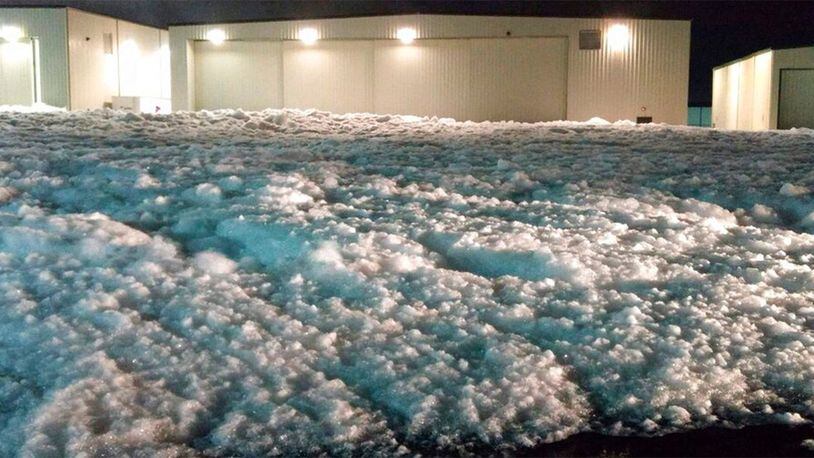 This photo provided by City of Manassas, Va., shows a foam filled a hangar that spilled out onto the road after a fire-suppression system malfunctioned Friday, Feb. 7, 2020 near Manassas Regional Airport. The city said a fire-suppression system malfunctioned at one of the businesses around the airport, causing white foam to fill a hangar. Overflow foam covered Wakeman Drive, which runs in front of the airport.