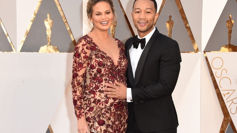 HOLLYWOOD, CA - FEBRUARY 28: Model Chrissy Teigen (L) and recording artist John Legend attend the 88th Annual Academy Awards at Hollywood & Highland Center on February 28, 2016 in Hollywood, California. (Photo by Jason Merritt/Getty Images)