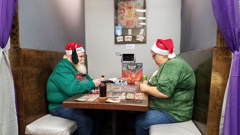 Dayton board game cafe Cardboard Crowns, wants to be the go-to spot for family and friends to gather around the table for some holiday gaming. Contributed photo