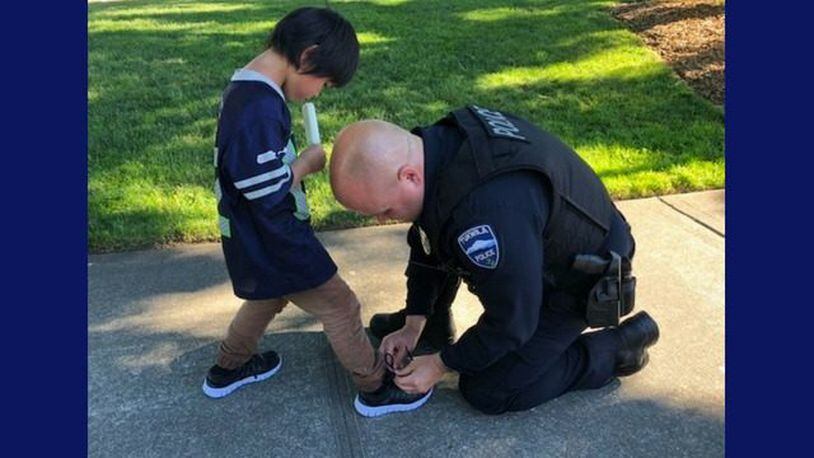 Officers saw a boy wearing dirty, torn socks and bought him a new pair of shoes. (Photo: Tukwila Police/Facebook)