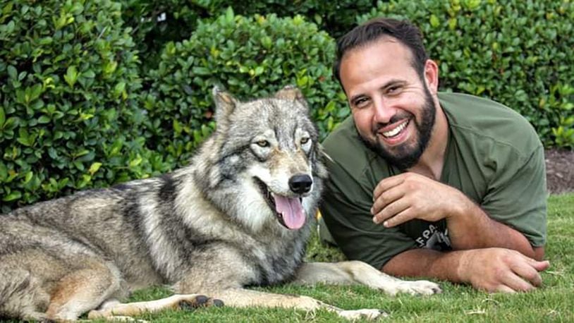 Adam Pinon and one of his wolfdogs, Gretl. Pinon is working through is non profit organization to educate people about animal ownership
