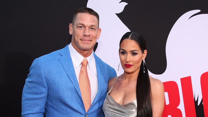 In separate interviews, John Cena (L) and Nikki Bella said they hope they get back together after calling off their engagement in April. (Photo by Christopher Polk/Getty Images)