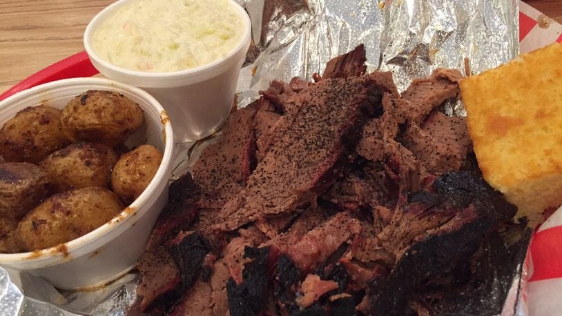 A one-pound serving of the beef brisket at Fatback’s Barbecue is definitely enough to share. Pictured with the roasted potatoes and cole slaw. We thank you kindly, Fatback’s. Contributed photo by Alexis Larsen