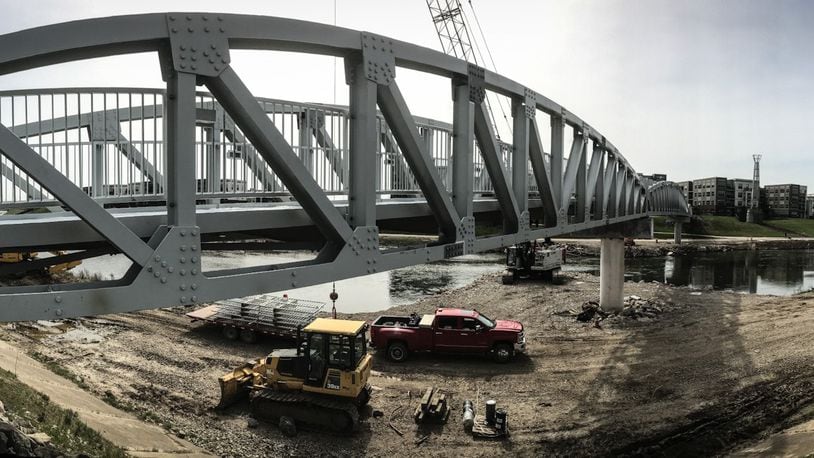 The pedestrian bridge that connects Deeds Point and RiverScape is scheduled to be complete this spring. JIM NOELKER/STAFF