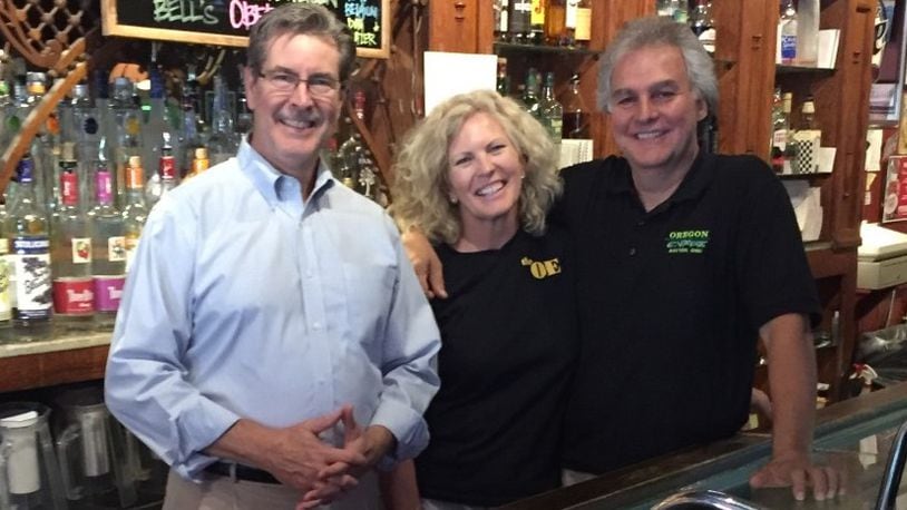 Terry Adkins (left), Susan and Joe Bavaro, owners of the Oregon Express Bar & Restaurant in Dayton’s Oregon Historic District. SUBMITTED