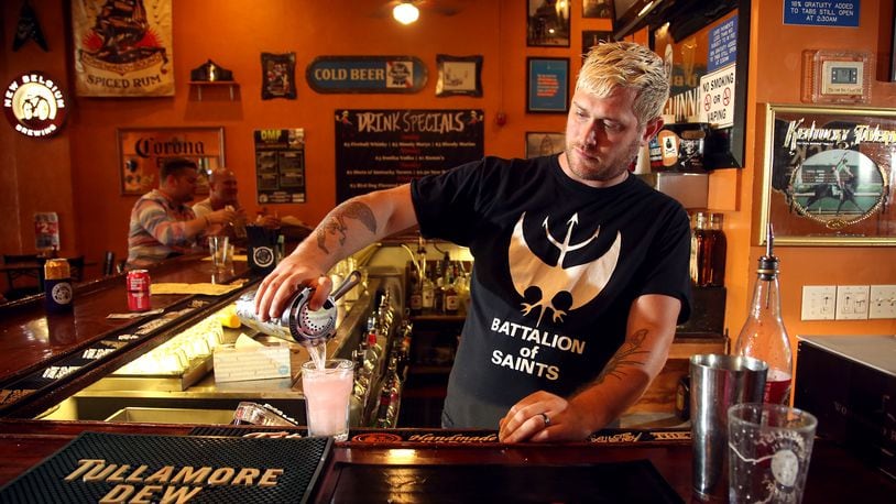 Josh Goldman has been the bartender at Blind Bob's in Dayton's Oregon District for 10 years. LISA POWELL / STAFF