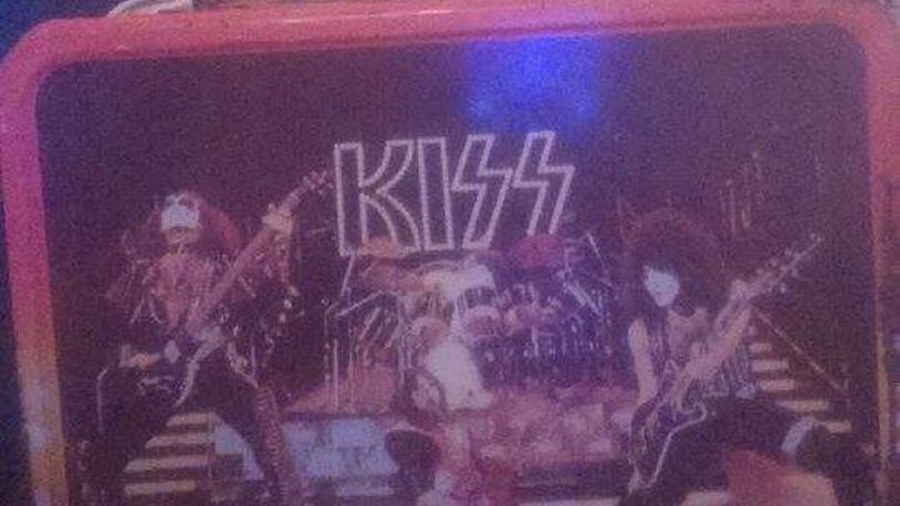 Ryan Roche of Dayton holds one of his most prized pieces in his KISS collection: the lunchbox.