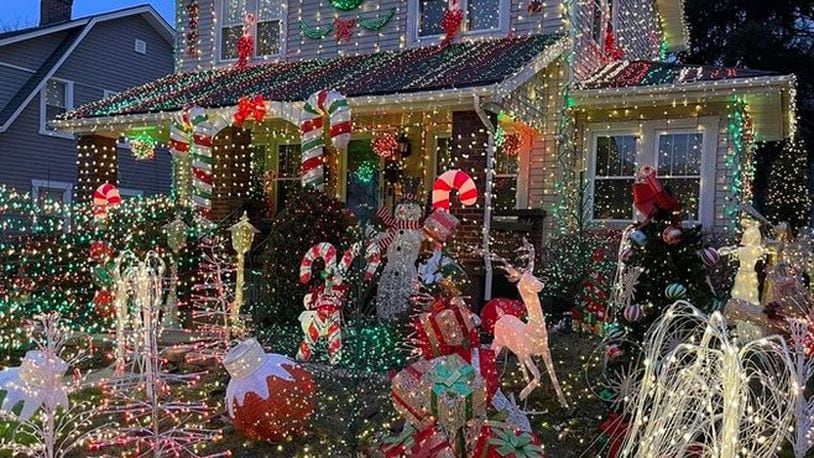 The city and an Oakwood resident are at odds over a large, holiday lights display that this year extends beyond her property. CONTRIBUTED